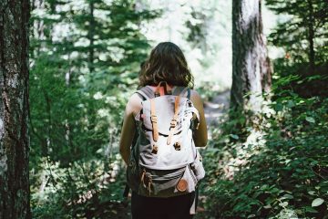 A woman trekking through the forest