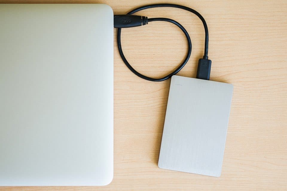 A hard drive plugged into a laptop