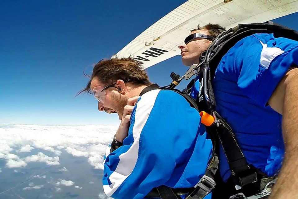 Two men jumping out of a plane