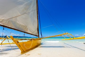 A sailboat moored on the beach