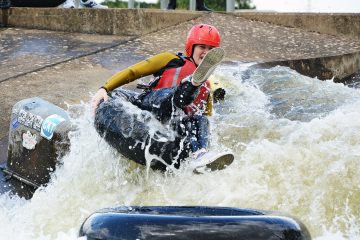 A woman on a tube on the rapids