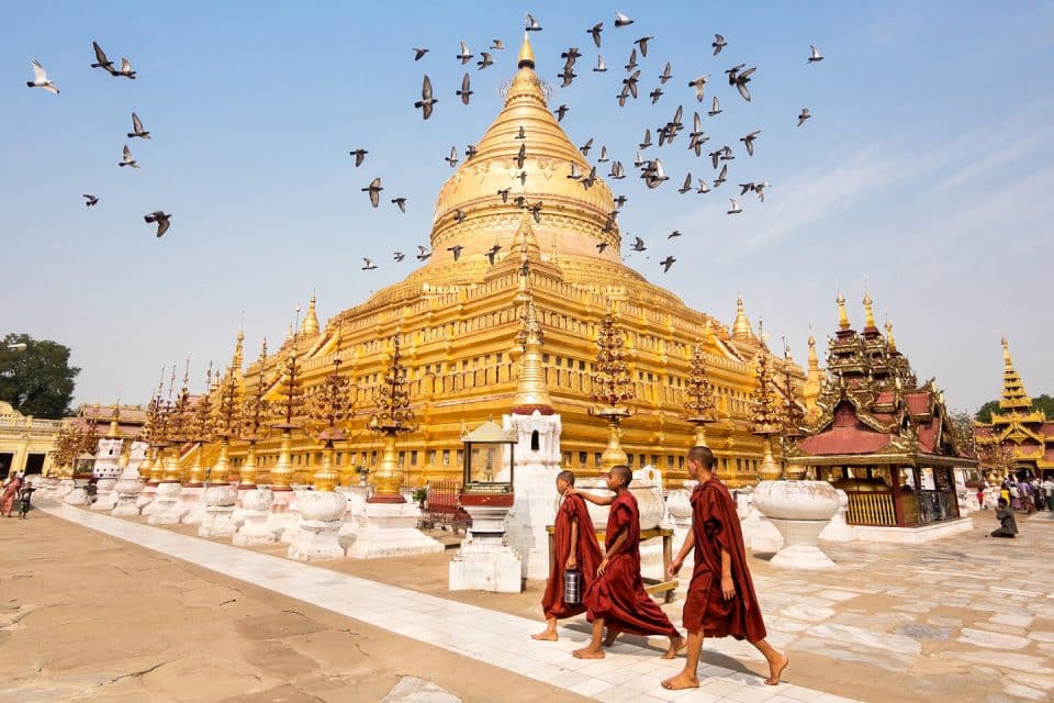 Monks outside a golden temple